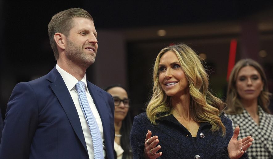 Eric and Lara Trump talks as President Donald Trump attends an indoor Presidential Inauguration parade event at Capital One Arena, Monday, Jan. 20, 2025, in Washington. (AP Photo/Evan Vucci) ** FILE **