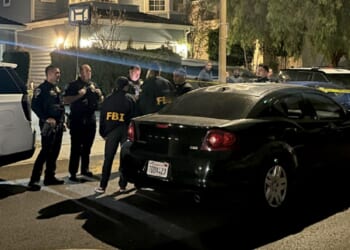 Torrance, California, gather Saturday night near a home linked to Cole Tomas Allen.