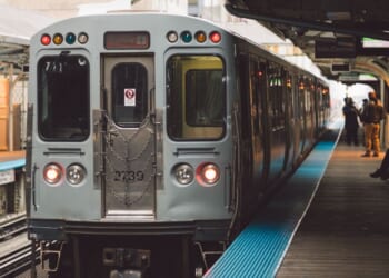 A train stationed at a railroad station platform in Chicago.