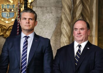 Secretary of War Pete Hegseth and Secretary of the Navy John Phelan stand together as President Donald Trump announced the creation of the “Trump-class” battleship during a statement to the media at Trump’s Mar-a-Lago estate on Dec. 22, 2025, in Palm Beach, Florida.