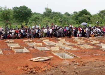 Catholics in north-central Nigeria bury 17 fellow worshippers and two priests after they were murdered in an attack led by Fulani herdsmen on May 22, 2018.