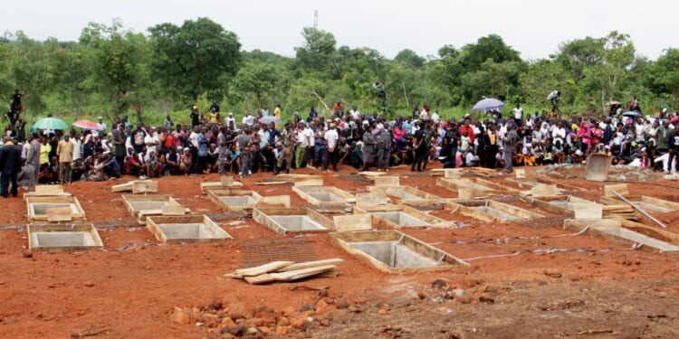 Catholics in north-central Nigeria bury 17 fellow worshippers and two priests after they were murdered in an attack led by Fulani herdsmen on May 22, 2018.