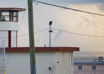 A Louisiana corrections officer looks out from a tower by Camp 57 at Angola Prison, the Louisiana State Penitentiary and America's largest maximum-security prison farm, in West Feliciana Parish, Louisiana, near the town of St. Francisville on Sept. 3, 2025.
