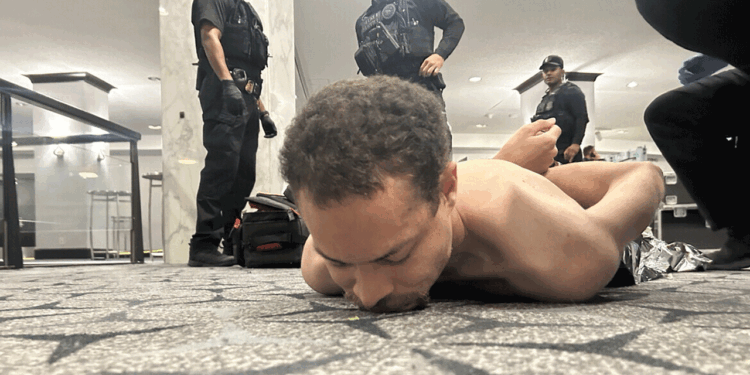 Cole Tomas Allen being detained by police after storming the White House Correspondents' Dinner