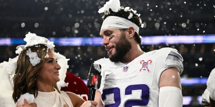 Diana Russini, left, interviews Harrison Smith #22 of the Minnesota Vikings on Netflix after the game against the Detroit Lions on Dec. 25 in Minneapolis, Minnesota.