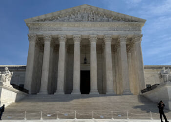 People walk outside the U.S. Supreme Court building in Washington, D.C., U.S., March 14, 2026. REUTERS/Will Dunham/File Photo