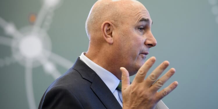 Hugh Grant, CEO of Monsanto, looking away from the camera