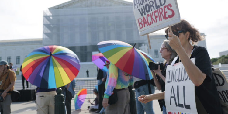 WASHINGTON, DC - APRIL 22: Protesters in support of LGBTQ+ rights and against book bans demonstrate outside of the U.S. Supreme Court Building on April 22, 2025 in Washington, DC. U.S. Supreme Court Justices heard arguments for the case of Mahmoud v. Taylor where a coalition of parents from Montgomery County, Maryland, say that a school requiring their children to participate in classes that include LGBTQ themes violates their religious beliefs and thus their First Amendment right to freely exercise their religion. (Photo by Anna Moneymaker/Getty Images)