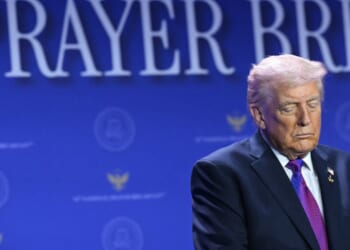 President Donald Trump bows his head in prayer during the National Prayer Breakfast at the Washington Hilton in Washington, D.C., on Feb. 5, 2026.
