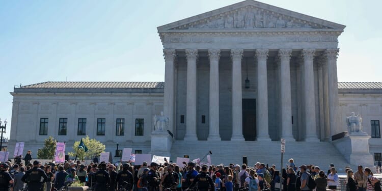 Protesters gather outside the Supreme Court building on April 27, 2026.