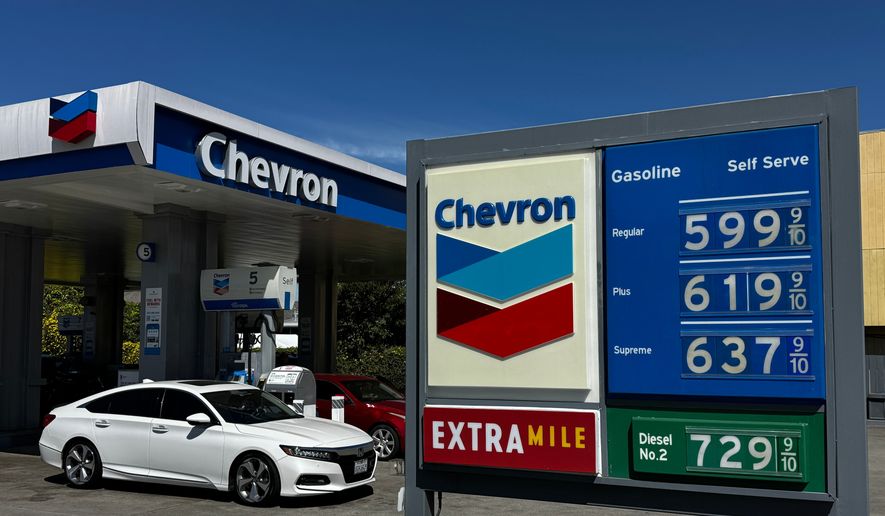 A Chevron gas station in Alameda, California, displays gas prices on March 23, 2026. (AP Photo/Terry Chea) ** FILE **