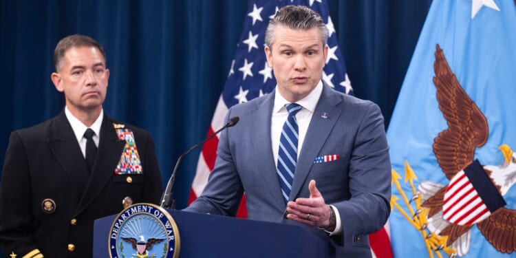 Secretary of War Pete Hegseth speaks alongside CENTCOM Commander Admiral Brad Cooper during a press briefing at the Pentagon in Washington, D.C., on April 16, 2026.