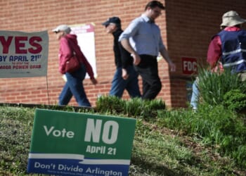Virginia voters leave a polling location after voting on a statewide ballot question.