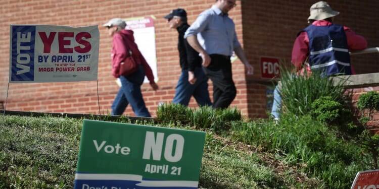 Virginia voters leave a polling location after voting on a statewide ballot question.
