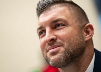 Tim Tebow, seen in a March 6 photo, had a heavenly perspective on his father's death.
