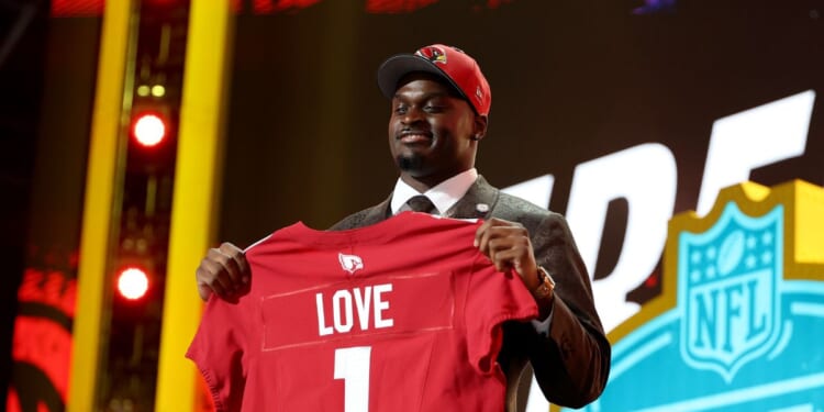 Jeremiyah Love of Notre Dame celebrates after being selected third overall pick by the Arizona Cardinals during Round One of the 2026 NFL Draft at Acrisure Stadium on April 23, 2026, in Pittsburgh, Pennsylvania.