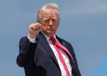 President Donald Trump gestures as he boards Air Force One on April 16, 2026, at Joint Base Andrews, Maryland.