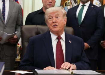 President Trump sits in the Oval Office alongside advisors and administration officials on April 18, 2026.