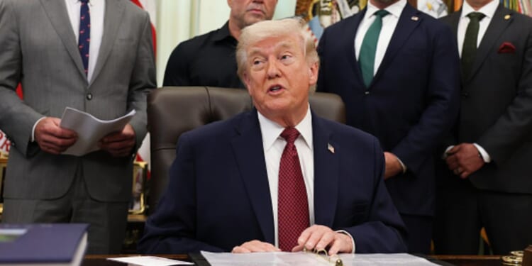 President Trump sits in the Oval Office alongside advisors and administration officials on April 18, 2026.