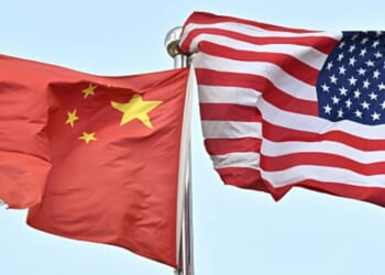 A Chinese flag and American flag wave side by side on April 17, 2025.