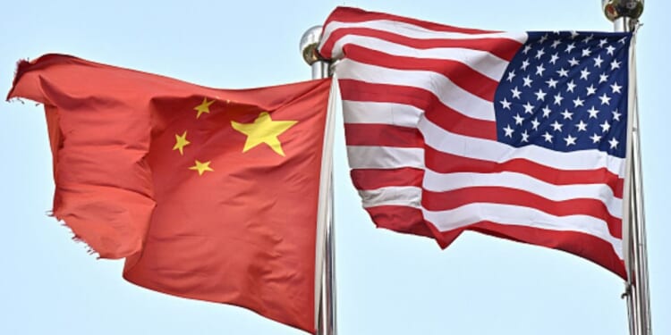 A Chinese flag and American flag wave side by side on April 17, 2025.