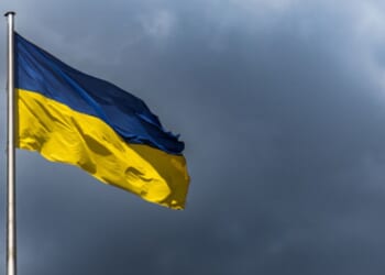 Ukranian Flag flies in gloomy skies.