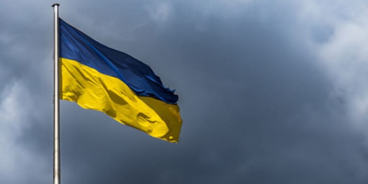Ukranian Flag flies in gloomy skies.