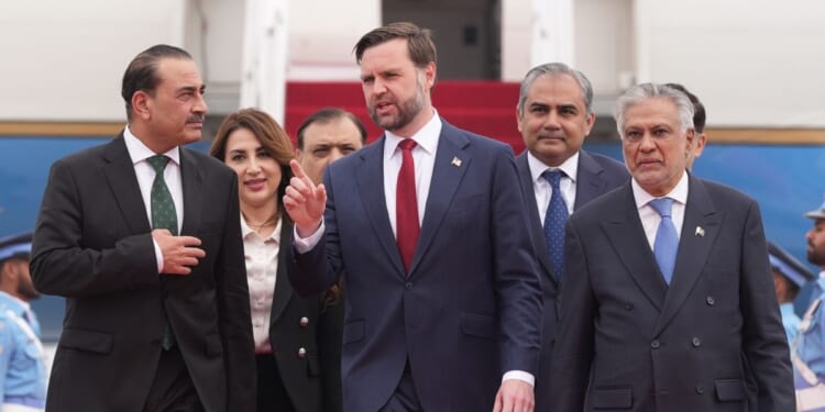 Vice President JD Vance walks alongside Pakistan Chief of Defence Forces and Chief of Army Staff Field Marshall Asim Munir, and Pakistani Deputy Prime Minister and Foreign Minister Mohammad Ishaq Dar just prior to negotiations with Iranian officials on April 11, 2026 in Islamabad, Pakistan.