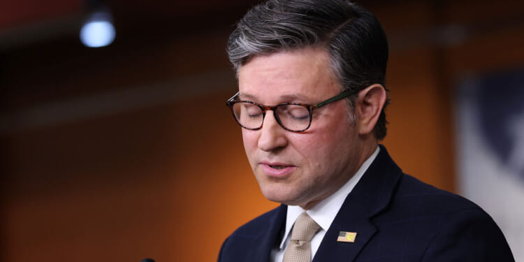 Mike Johnson speaks to reporters at a capitol press conference.