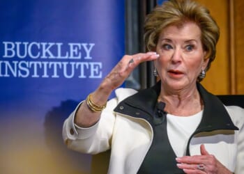 Education Secretary Linda McMahon seated