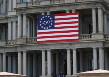 The Eisenhower Executive Office Building with a flag celebrating the United States' 250th anniversary is seen in Washington, D.C., on April 24, 2026.