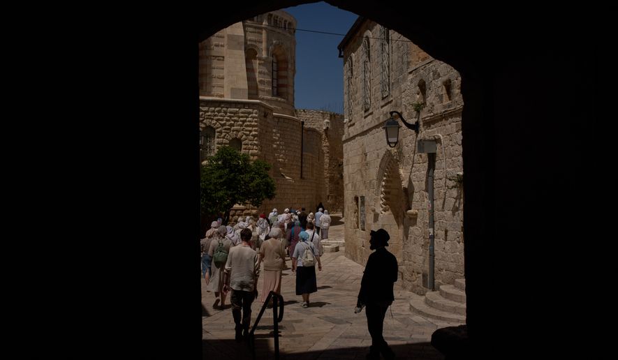Christian pilgrims walk past the site where a nun was attacked by a man last Wednesday, after visiting the Cenacle, traditionally believed to be the site of the Last Supper, in Jerusalem, Friday, May 1, 2026.(AP Photo/Leo Correa)