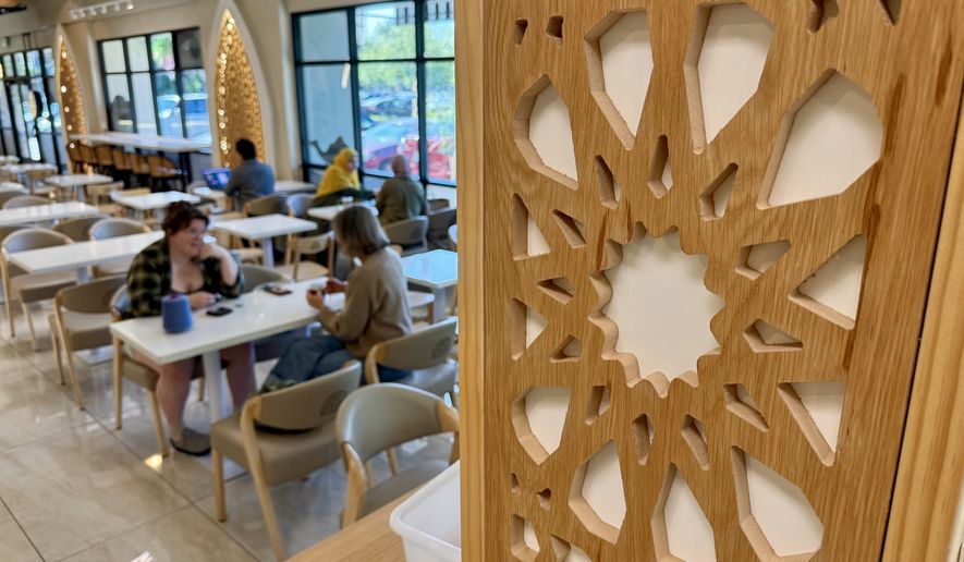 Customers are seen inside Arwa Yemeni Coffee on April 6, 2026, in Sunnyvale, Calif. (AP Photo/Haven Daley)