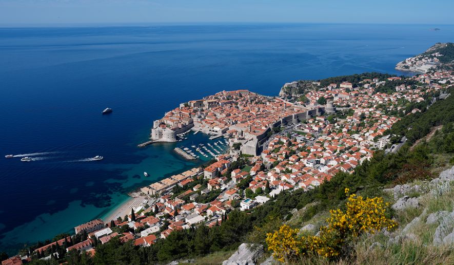 Old town of Dubrovnik, Croatia, lines the shore of the Adriatic Sea, Monday, April 27, 2026. (AP Photo/Darko Bandic)