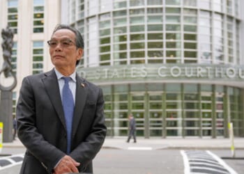 He’s accused of running a Chinese spy outpost. His lawyer says it was a place to play ping-pong