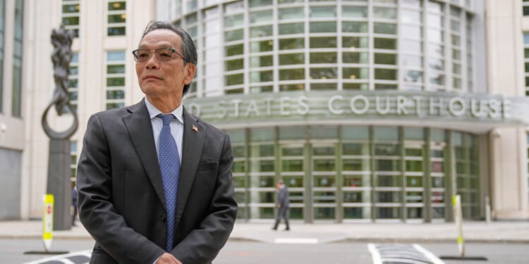 He’s accused of running a Chinese spy outpost. His lawyer says it was a place to play ping-pong