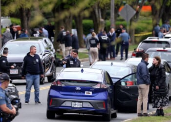 Man with an assault rifle sprays rounds at drivers near Boston, wounding 2 before being shot