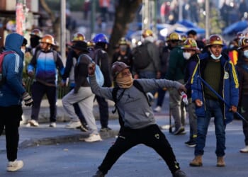 Clashes erupt in Bolivia as miners set off dynamite and police fire tear gas