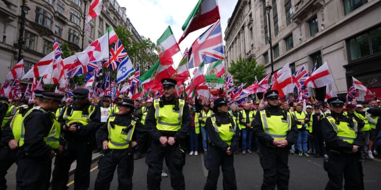 London police out in force dealing with rival rallies and a soccer final