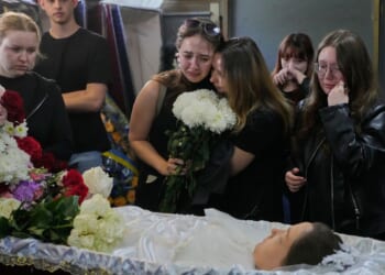 Young Kyiv couple killed in a fierce Russian airstrike hoped to start a family, mourners say