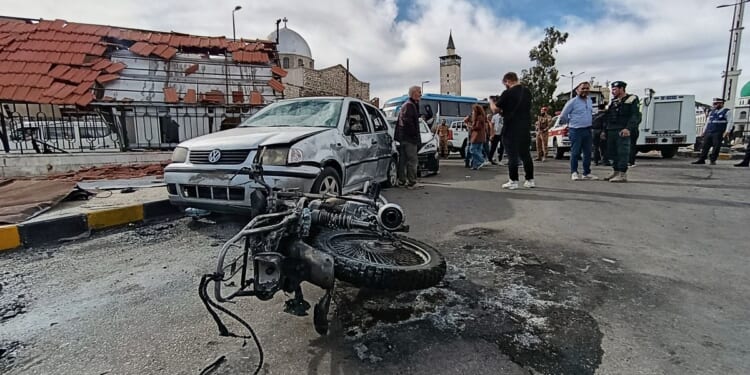 Blast outside a Syrian defense ministry building kills a soldier, wounds 12 people