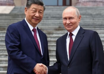Putin and Xi hail their high-level ties and growing energy trade as they meet in Beijing