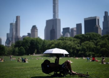 Eastern U.S. sweats through another hot day before rain, cold move in