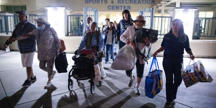 Evacuation centers fill up in Southern California as efforts continue to cool damaged chemical tank