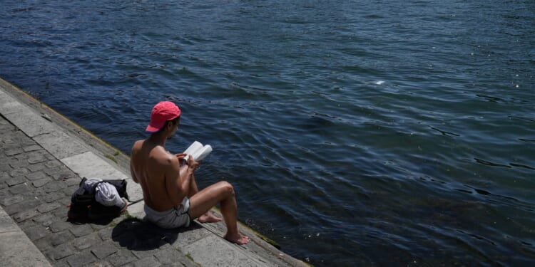 Parts of Europe swelter in record May heat as deaths at amateur sports events spur warnings
