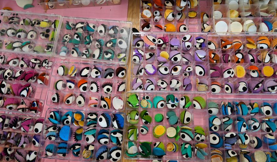 Trays full of eyes, used to make puppets, are seen at Jim Henson's Creature Shop in New York, Wednesday, May 13, 2026. (AP Photo/Seth Wenig)