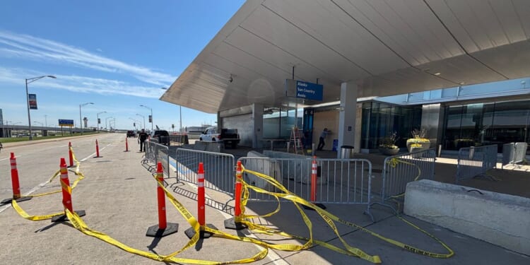 Car crashes into a passenger terminal at Detroit Metropolitan Airport, driver arrested