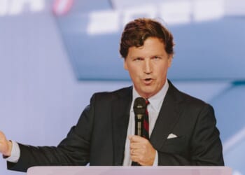 Conservative political commentator and podcast host Tucker Carlson speaks at Turning Point USA's annual AmericaFest conference, in remembrance of late political activist Charlie Kirk, in Phoenix, Arizona, on Dec. 18, 2025.