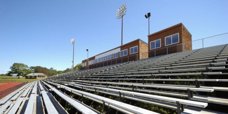 Stadium seats at an outdoor track.