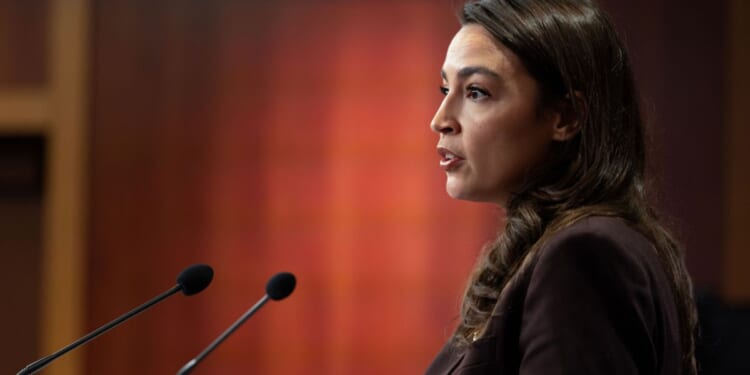 Rep. Alexandria Ocasio-Cortez speaks at a press conference to announce the Artificial Intelligence Data Center Moratorium Act at the U.S. Capitol on March 25, 2026, in Washington, D.C.